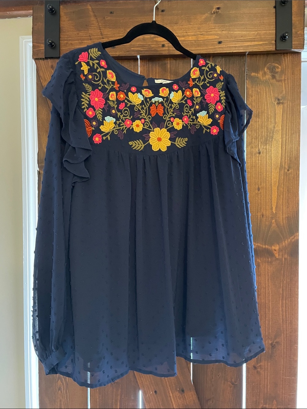 Navy Swiss Dot Ruffle Sleeve Blouse with Floral Accent